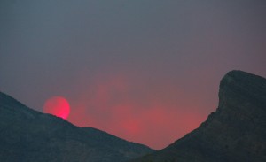 Heavy smoke from carpenter canyon fire dims the setting sun.